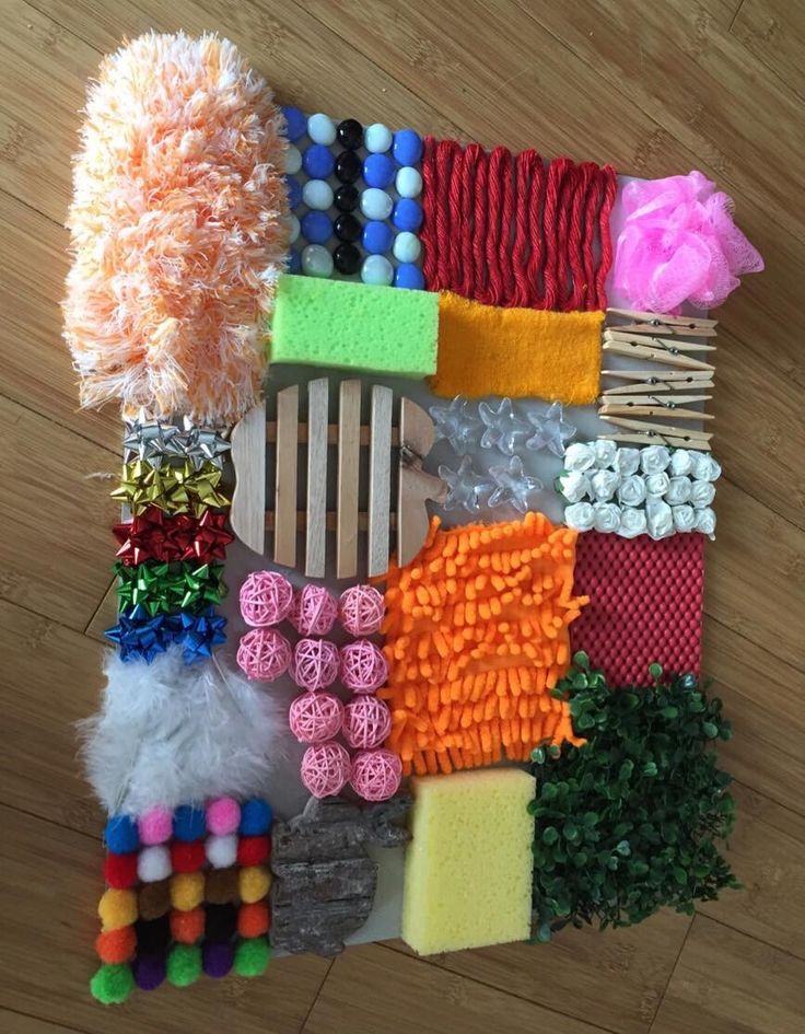 DIY Sensory board ideas to encourage your busy babies and toddlers to explore new textures, objects, and incorporate fine motor skills.