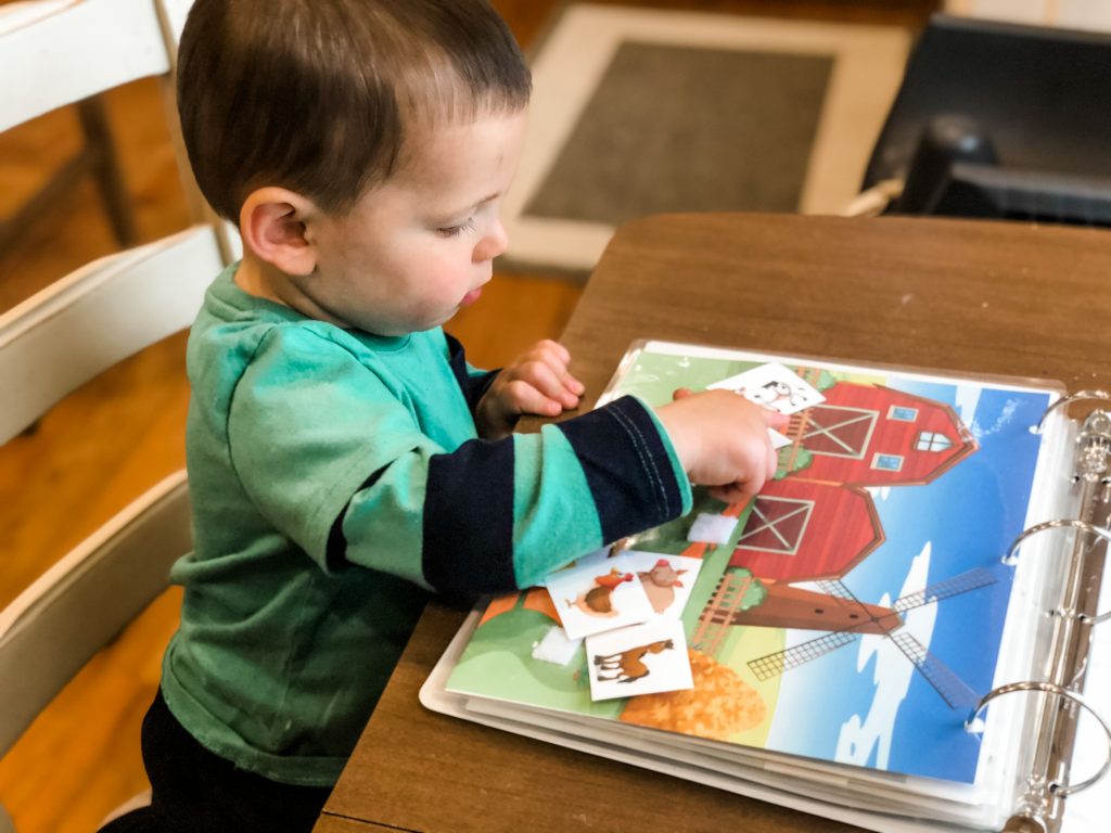 Make a busy binder for your toddler or preschooler to help them learn new concepts. DIY the quiet book for your child with velcro and a binder.
