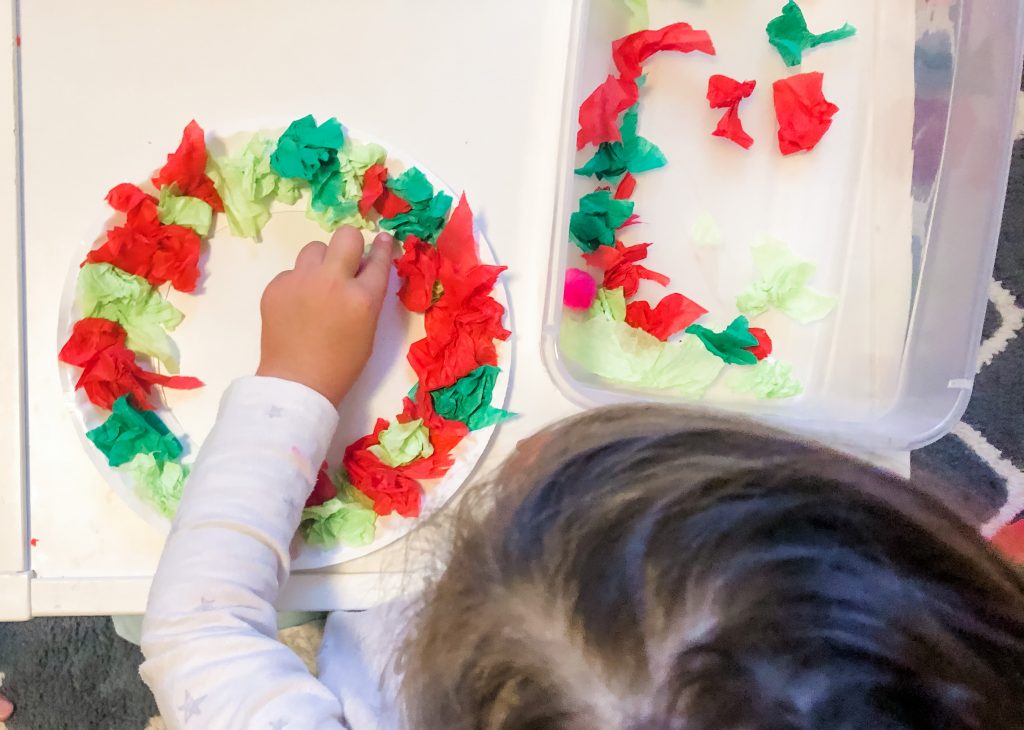Toddlers and Preschoolers will love this fun tissue paper Christmas activity. Help them build fine motor skills, math and language skils