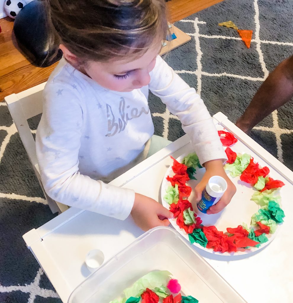 Toddlers and Preschoolers will love this fun tissue paper Christmas activity. Help them build fine motor skills, math and language skils
