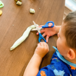 Teach Scissor Skills by Cutting Play-Doh