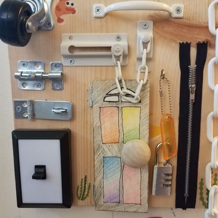 DIY Sensory board ideas to encourage your busy babies and toddlers to explore new textures, objects, and incorporate fine motor skills.