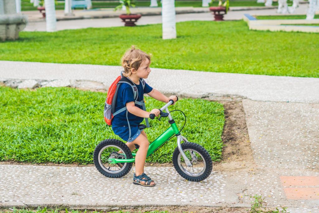 It's so easy to teach a kid to ride a bike when using a balance bike to begin instead of the standard training wheels. Here's some great tips on how to do it quickly and safely.